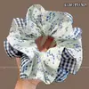 Goma de pelo de satén azul con lunares florales para mujer, Sujetador de moño de alta gama, Accesorio para coleta baja