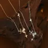 Cadena de Clavícula Elegante con Circonita Microincrustada Galvanizada en Oro Real para Mujer 2024 Nueva Cadena de Cuello Versátil Exquisita con Colgante de Estrella de Cuatro Hombres