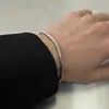 Moda 2024 moderna simple cadena lisa pulsera de cadena de hueso de serpiente para pareja acero de titanio no se decolora pulsera de cadena redonda de hueso de serpiente