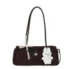 Bolso de hombro tipo baguette de moda y tendencia estilo coreano transfronterizo para mujer, nuevo modelo 2026, simple, delicado, dulce, con lazo