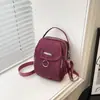 Bolso bandolera moderno y elegante para mujer, bolso de hombro de color liso, nuevo bolso para teléfono de estilo coreano casual y simple primavera 2026