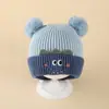 Bonitos y adorables gorros de otoño e invierno para niños, con diseño de poner, material de punto y una serie de dibujos animados, que brindan abrigo y protección para los oídos para bebés y niños pequeños.