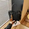 Bolso de hombro de moda transfronterizo para mujer, elegante diseño de bloques de color, bolso tote simple y versátil para el trabajo, retro y casual