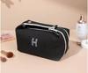 Bolsa de cosméticos portátil, bolsa de lavado portátil simple, bolsa de almacenamiento de viaje impermeable y a prueba de polvo, fábrica japonesa de gran capacidad al por mayor