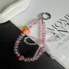 Exquisita y creativa cadena de cristal para teléfono de manzana, accesorio de llavero universal de lazo de moda nicho para bolso