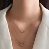 Collar Clavícula Retro Francés de Imitación Perla con Borla de Corazón de Tres Capas Apilable Europeo y Americano Nicho Temperamento de Gama Alta para Mujeres