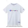 Camiseta de Manga Corta de Algodón Puro Unisex 2026 Nueva Camiseta Bordada Holgada Ins Marca de Moda Estilo Japonés Hong Kong Top Verano