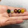 Venta al por mayor Cuentas Sueltas Grabadas Ágata Natural Estampado en Caliente Cinco Elementos Bestia Mítica Estampado en Caliente Cuentas Redondas Oro Madera Agua Fuego Tierra Pulsera Combinación