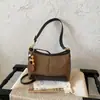 Moda estilo coreano design retrô de nicho bolsa de axila 2026 novo estilo artístico de nicho bolsa de ombro único transversal
