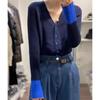 Suave diseño de viento perezoso ceroso sentido de diseño productos europeos súper atractivos azul Klein con cárdigan de punto suéter femenino invierno figura de red