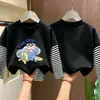 Camiseta de manga larga para niño 2026 nuevo modelo, camiseta básica de dibujos animados para niño, camiseta interior de algodón puro a rayas para otoño, estilo primavera y otoño