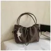 Bolso de hombro plisado de nicho estilo coreano transfronterizo 2026 para mujer, versátil, para el trabajo, bandolera tipo cubo