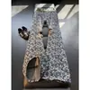 Pantalones de hip-hop de alta calle europeos y americanos, marca de moda, elegantes y geniales, jeans de jacquard con estampado completo para hombre, ligeramente acampanados, pantalones rectos adelgazantes
