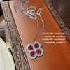 Anillo de gema de sangre roja de paloma brillante chapado en oro de 18 quilates con circonita multifacética y corindón rojo. Conjunto de collar y anillo de mariposa.