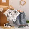 Traje Casual de Verano para Niños de Manga Corta 2026 Nueva Ropa de Verano para Bebé Conjunto de Dos Piezas de Camiseta Rota de Manga Corta para Bebé