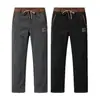 Suministro directo desde la fuente. Pantalones chinos cálidos de pana gruesa con forro polar de invierno. Personalizado según tu diseño, disponible para dropshipping