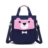 Nueva bolsa de mano para tareas al por mayor para estudiantes Bolsa de maquillaje cruzada para estudiantes de primaria Gran capacidad Mochila escolar para estudiantes LOGOTIPO personalizado