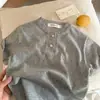Camisetas de Verano de Manga Corta para Niños y Niñas Bebé Elegantes Personalidad Infantil Moda Tendencia Estilo Coreano Color Sólido Botones Celebridad de Internet Manga Media