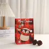 Bolsa de compras de papel kraft Bolsa de regalo de muñeco de nieve navideño Impresión bolsa de embalaje para regalo de fiesta Bolso de mano de dibujos animados al por mayor