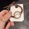 Coletero de aleación con forma de cuerda para el pelo para mujer, banda para el pelo con perlas para pareja, banda de goma estilo coreano, accesorios para el pelo de otoño e invierno estilo Chanel