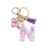 Chaveiro de Resina com Alfabeto Inglês A-Z Pingente de Borboleta Roxa com Franja Pingente para Bolsa Feminina Chaveiro de Carro