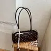 Bolsa baguette de nicho estilo francês Shuai Mijia para mulheres, nova versão coreana 2026, bolsa de ombro casual com bolinhas e laço para o dia a dia