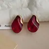 Pendientes elegantes y sofisticados de resina ámbar para mujer, pendientes de empalme de metal de lujo ligero de nicho, accesorios para orejas de venta caliente 2026