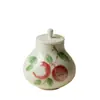 Rinno Gui Song Cerámica Porcelana Transparente Esmalte Bajo Pastel Lichi Mini Recipiente para Té Sellado Creativo de Alto Valor Recipiente a Prueba de Humedad