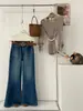 Jeans acampanados de otoño TOP estilo europeo de Guangzhou Trece Líneas vintage de alta resistencia con pliegues elásticos 360 grados con cinturón 61828