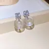 Aretes Redondos de Resina 'Bola de Hielo Transparente' Incrustados con Agujas Plateadas y Diamantes, Aretes de Estilo Minimalista de Moda con un Diseño Sencillo para Mujer