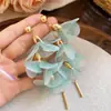 Pendientes de borla de flor de cuentas de color dopamina para primavera, sensación de lujo ligero y alta gama, pendientes atmosféricos estilo vacacional para mujer