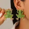 Pendientes de animales divertidos de fiesta navideña europea y americana con personalidad de hip hop rock para mujer, con gorro navideño y ranita.