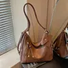 Bolsa de ombro nova moda outono 2026 transfronteiriça, bolsa tote transversal de grande capacidade para o dia a dia, mochila retrô de alta qualidade