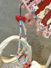 Princesa solta laço vermelho plano fruta corrente de celular corrente de pendurar com contas diy contraste vermelho e azul corrente de pendurar câmera ccd