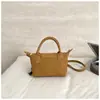 Bolsa de ombro transversal de palha trançada artesanal transfronteiriça, bolsa de bolinho, moda nova, simples, feminina, bolsa Longchamp, bolsa trançada