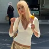 Roupas femininas transfronteiriças 2026 outono nova moda cor sólida manga três quartos gola V renda sexy com acabamento slim fit camiseta top