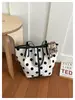 Bolsa feminina grande de bolinhas 2026 nova casual moderna luxo leve tote ombro axila