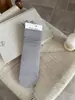 Calcetines holgados versátiles sin costuras para mujer, estilo coreano otoño e invierno para estudiantes, calcetines de media pantorrilla color blanco lechoso, calcetines largos de algodón de color liso para adolescentes