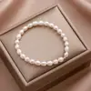 Pulsera de cuerda elástica de cuentas de mijo de perlas de agua dulce naturales no se desvanece nicho super hada todo-combinable accesorios de pulsera de perlas