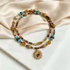 Collar con colgante de girasol y ojo de tigre de estilo étnico de lujo ligero y colorido con cuentas, cadena para la clavícula vintage de nicho estilo vacacional para mujer