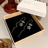 Pendientes de Lujo Ligero de Nicho de Gama Alta con Estampado de Leopardo y Estrella de Cinco Puntas para Mujer, Modernos y Versátiles, Pendientes Largos con Borlas