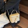 Bolsa de mão de alta qualidade com alça de mão, nova moda retrô, casual, bolsa de ombro, bolsa mensageiro de nicho, primavera 2025