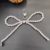 Nuevo Colgante de Lazo de Amor Plateado para Funda de Teléfono Móvil Llavero Colgante Versátil Exquisito Regalo Pequeño Accesorios para Equipaje