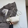 Bolso cruzado de nicho versión coreana 2025 Verano Nuevo Bolso de mano blanco para mujer Moda Bolso pequeño para mujer