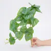 Colgante de pared de vegetación de hoja de sandía artificial, hoja redonda, hoja de monstera, flor artificial, enredadera colgante de plástico, decoración de pared de plantas, accesorios decorativos, flor