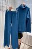 Otoño e invierno 2023 Nuevo traje de punto de estación europea de aguja gruesa para mujer suéter de cuello alto pantalones de pierna ancha traje de dos piezas casual de moda