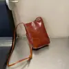 Bolsa feminina de couro bovino de primeira camada, bolsa balde de ombro e transversal, bolsa simples para celular, carteira de moedas vintage de couro macio, prática, de couro genuíno