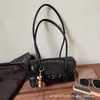 Bolso tipo baguette retro para mujer 2026 Nuevo Ligero Lujo Nicho Gama Alta Para ir al trabajo Simple Casual De mano Bolso de hombro