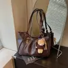 Transfronterizo Otoño 2026 Nuevo Estilo Coreano Simple Bolso de Hombro para Mujer Bolso Tote Vintage de Moda Versátil Bolso de Mano para Viajar
