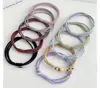 Corda de Cabeça Simples de Quatro Fios Elástico de Borracha Corda de Cabelo Feminina Novo Estilo Primavera e Verão 2025 Anel de Cabelo Elegante para Rabo de Cavalo Estojo de Couro Alta Elasticidade